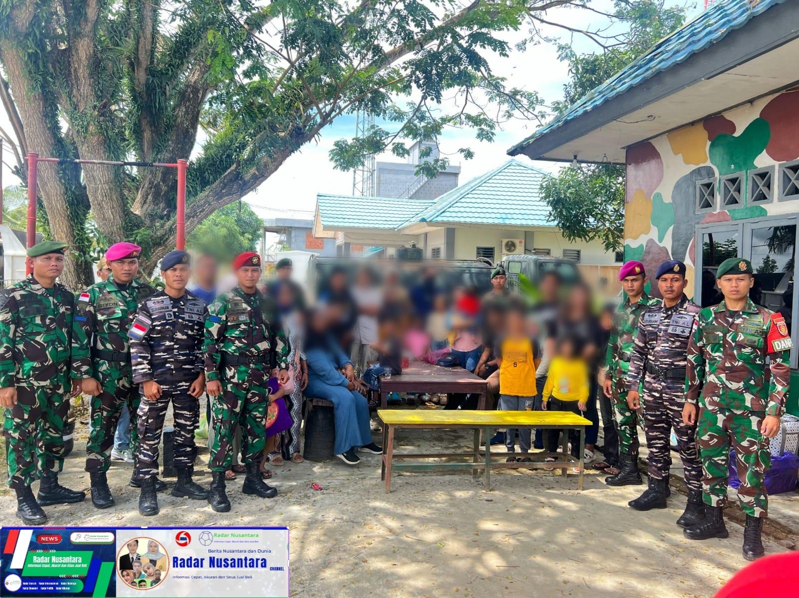 Satgas Pamtas Yonarmed 11 Kostrad Gagalkan Penyelundupan 23 CPMI Ilegal ke Malaysia